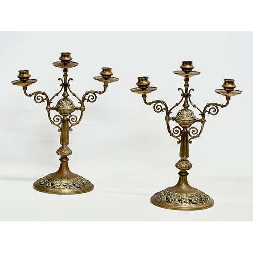 60E - A pair of large Victorian pierced brass candelabras. 29x16.5x38cm