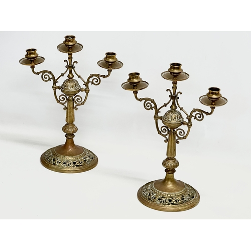 60E - A pair of large Victorian pierced brass candelabras. 29x16.5x38cm