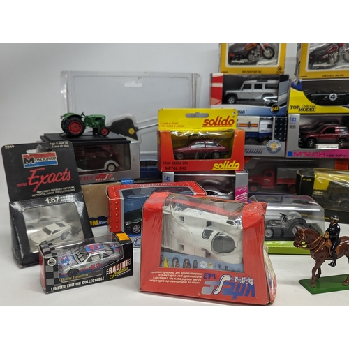 689 - A collection of model cars including Solido, Vanguards, Cararama, etc