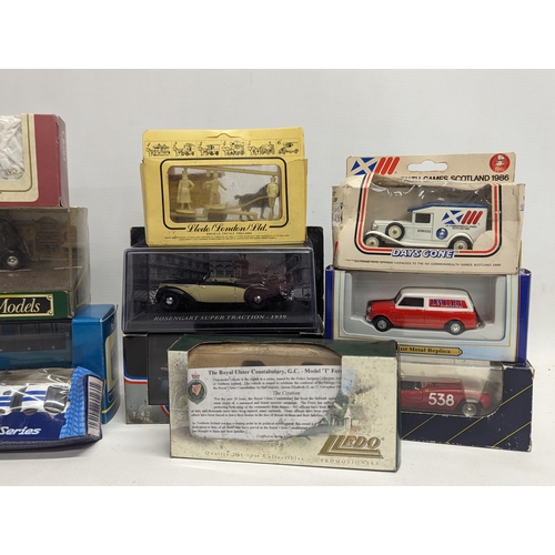 705 - A collection of model cars and trucks including Corgi, Lledo, Oxford Die-Cast, Minichamps, etc