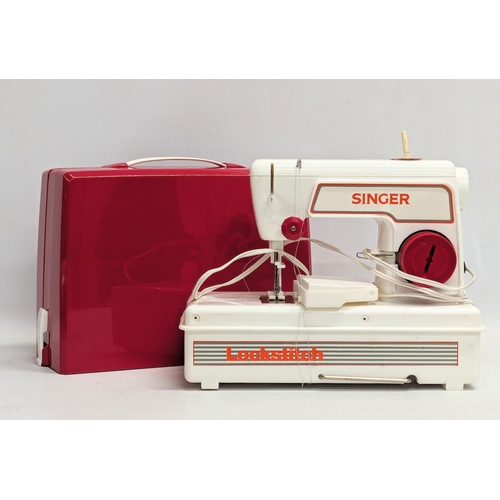 751 - A Singer 'Lockstitch' sewing machine for children in original box.