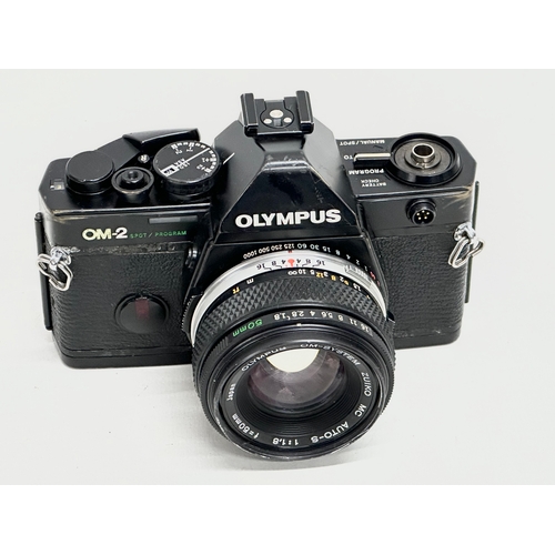 761 - A vintage Olympus OM-2 camera.