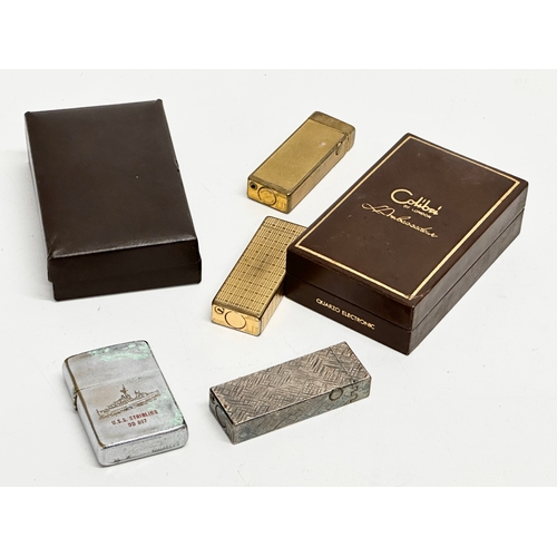 514 - A collection of vintage lighters. 3 Dunhill lighters. 2 Colibri lighters with boxes and a Zippo U.S.... 