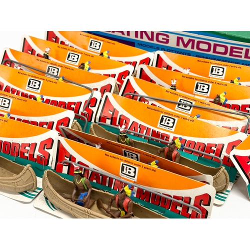 583 - A Britains Herald Floating Models 14 Indian Canoes with box.