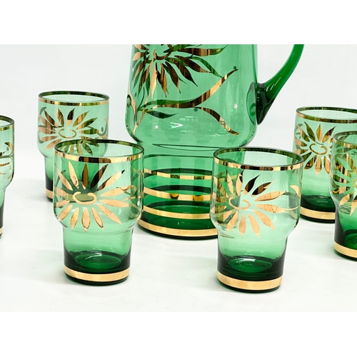 200I - A 1970’s Mid Century Bristol Green and gilt drinks set. Jug measures 17x11.5x24cm. Glasses 7x10.5cm