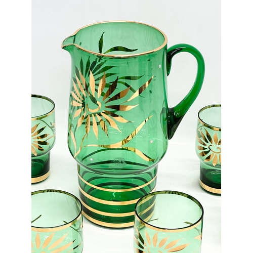 200I - A 1970’s Mid Century Bristol Green and gilt drinks set. Jug measures 17x11.5x24cm. Glasses 7x10.5cm