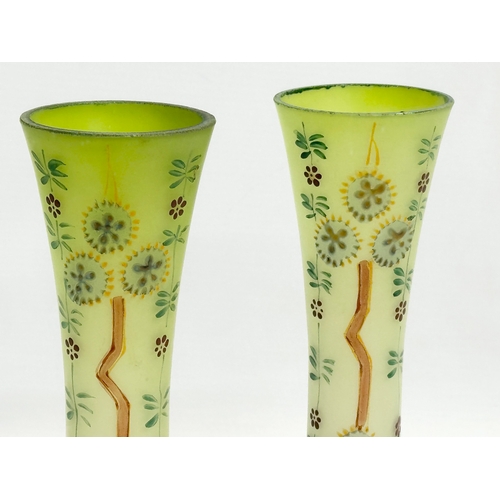 175F - A pair of late 19th/early 20th century hand painted glass vases. 21cm