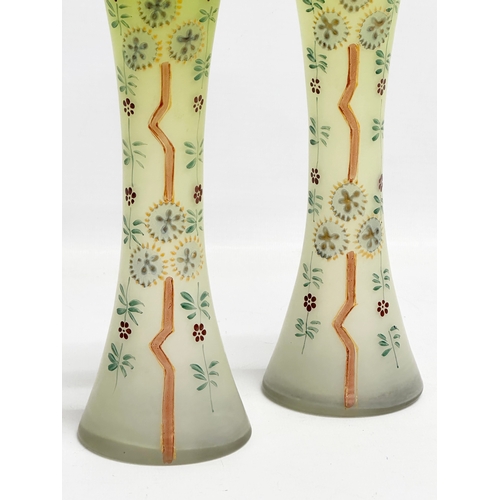 175F - A pair of late 19th/early 20th century hand painted glass vases. 21cm