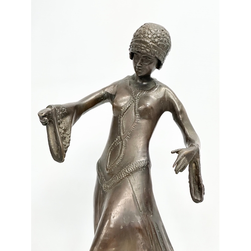 275F - A large Art Deco bronze figurine in the manner of Demetre Chiparus. 27x20x45cm