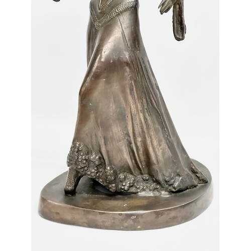 275F - A large Art Deco bronze figurine in the manner of Demetre Chiparus. 27x20x45cm