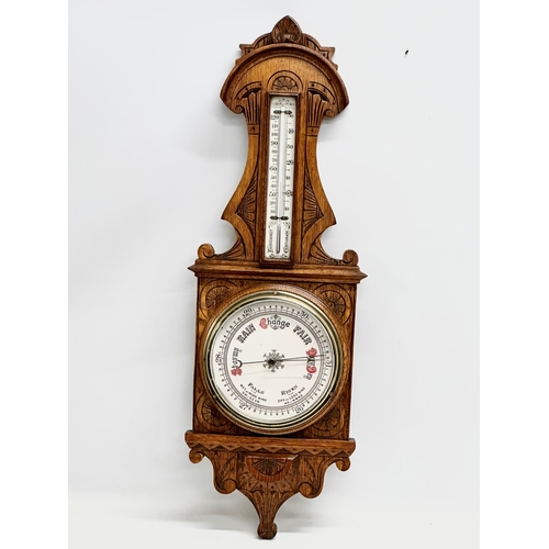 120 - A Victorian carved oak barometer. 28x84cm