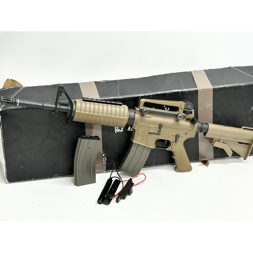 588 - An Umarex Elite Force electric assault rifle with box, pellets, tactical vest, carting case etc. rif... 