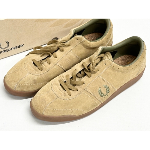 525D - A pair of Fred Perry trainers with box. Size 10.