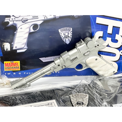 589 - A Marvel Universe Collection Nick Fury’s NF300 Gun & Badge. Factory X Certificate of Authenticity. 6... 