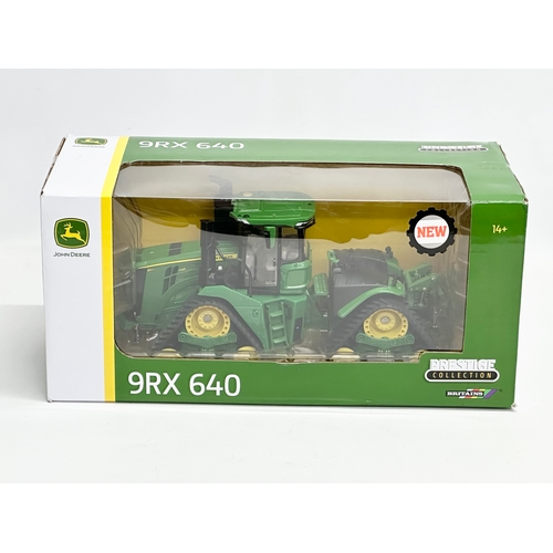 718 - A new large Britains Prestige Collection John Deere 9RX 640 in box. 33x15x16cm