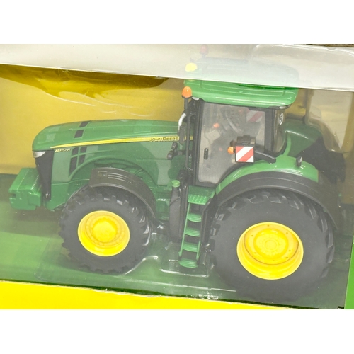 720 - A new Britains John Deere 8370R tractor in box. 25x13x15.5cm