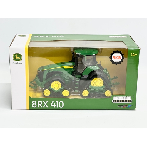 722 - A new large Britains Prestige Collection John Deere 8TX410 tractor in box. 30x15x14cm