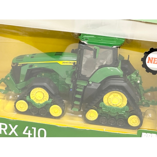 722 - A new large Britains Prestige Collection John Deere 8TX410 tractor in box. 30x15x14cm