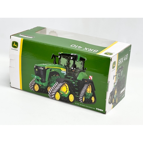 722 - A new large Britains Prestige Collection John Deere 8TX410 tractor in box. 30x15x14cm