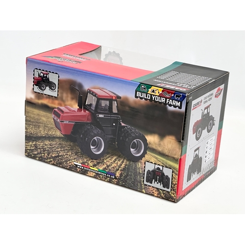 724 - A new Britains Prestige Collection Case International 4894 tractor in box. 25x14x15cm