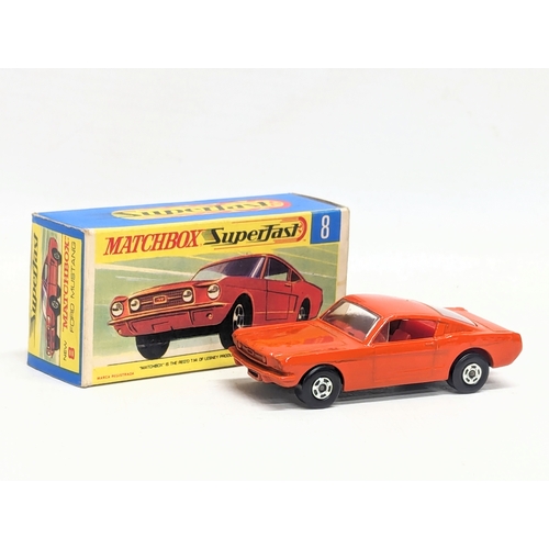 598 - A vintage Matchbox Super fast No. 8, Ford Mustang in red/orange, with original box.