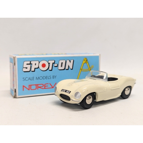 696 - A vintage Norev Spot-on Jaguar XKSS model car. 1/42