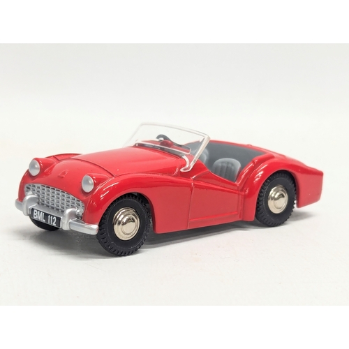 697 - A vintage Norev Spot-on Triumph T. R. 3. model car. 1/42