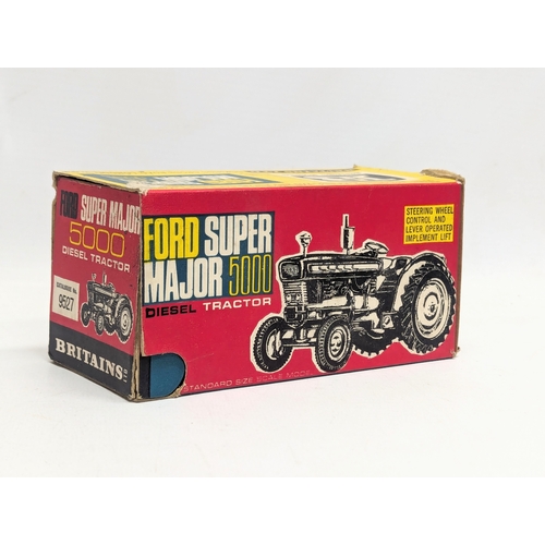 699 - A vintage Britains Ford Super Major 500 Diesel Tractor model.