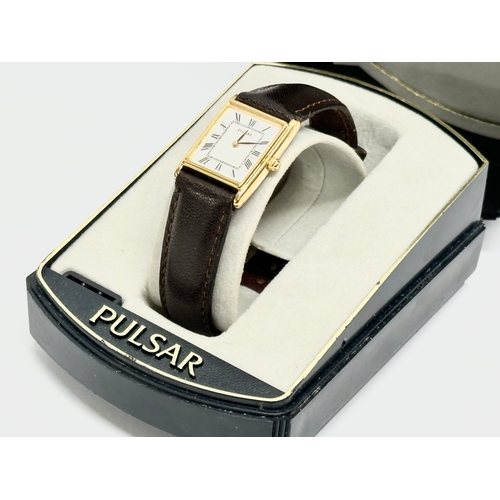 525O - A Pulsar watch with case.