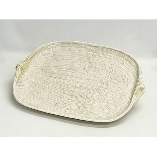 345V - A 3rd period Belleek Pottery ‘Tridacna’ tray. 1926-1946. 44x36cm