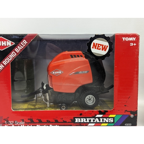 792 - 2 new Britains models, a Kuhn Round Baler and a Britains Land Roller. 1:32