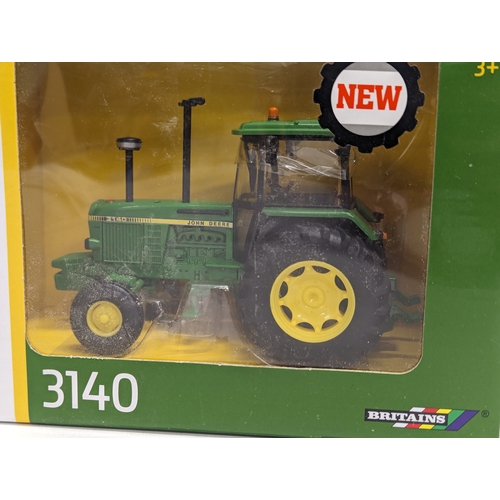 796 - 2 new Britains John Deere tractor models, 3140 & 3640. 1/32.