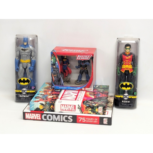 799B - A sundry lot including 2 DC Comic figures of Batman and Robin by Spin Master, a Marvel Encyclopedia,... 