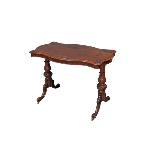 1137 - A Victorian mahogany library table with serpentine top and turn supports on cabriole legs. Circa 186... 