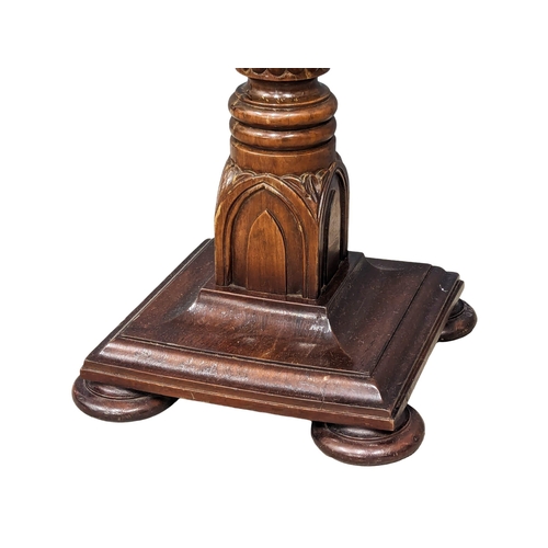 1138 - A tall mahogany torchiere stand with reeded column and cranthus decoration.  32x134cm(9)