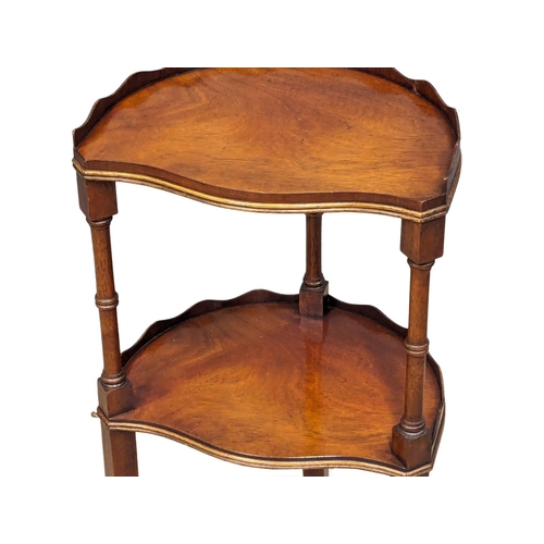 1144 - A small George III style mahogany 2 tier table with gallery and splayed legs.  34x27x71cm(12)