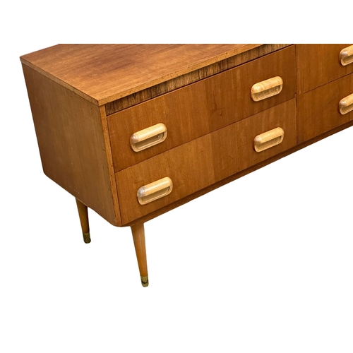 1145 - A Mid Century teak compact sideboard. 107x41x64cm(1)