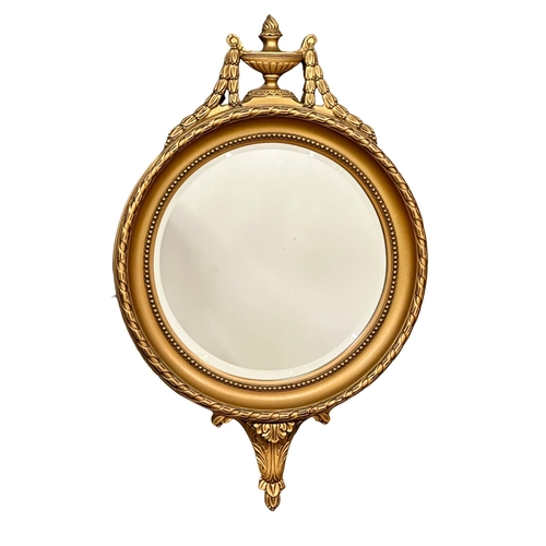 102 - A vintage Regency style gilt framed mirror. 39.5x64cm