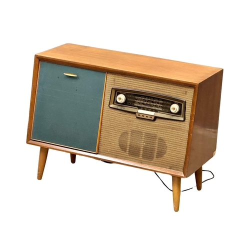A Mid Century teak Bush radiogram with Gerrard turntable. 84x38x62cm(3)