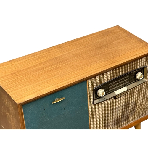 A Mid Century teak Bush radiogram with Gerrard turntable. 84x38x62cm(3)
