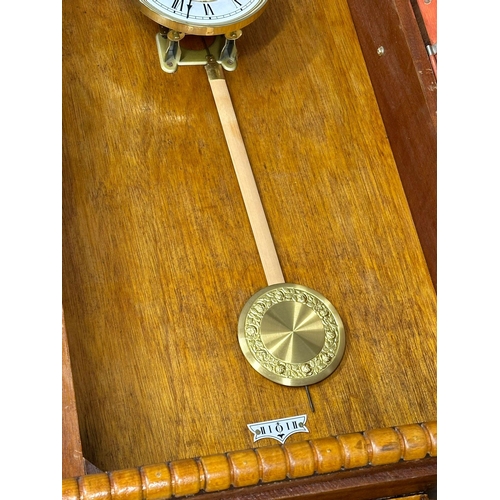 322 - A large wall clock barometer. 61x23x165