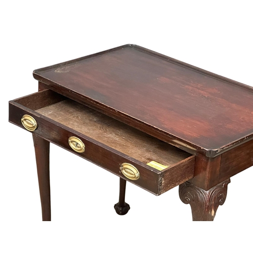 821 - A mid 19th century Irish Chippendale Revival mahogany silver table with drawer on Ball & Claw feet. ... 