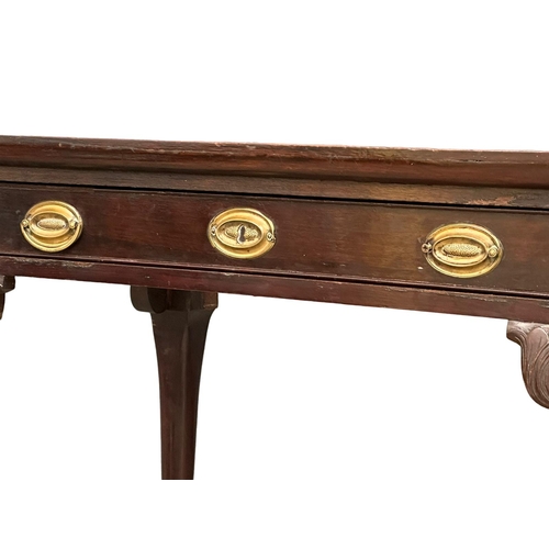 821 - A mid 19th century Irish Chippendale Revival mahogany silver table with drawer on Ball & Claw feet. ... 