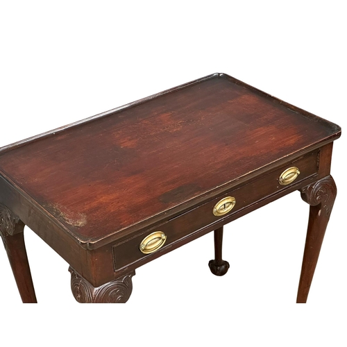 821 - A mid 19th century Irish Chippendale Revival mahogany silver table with drawer on Ball & Claw feet. ... 