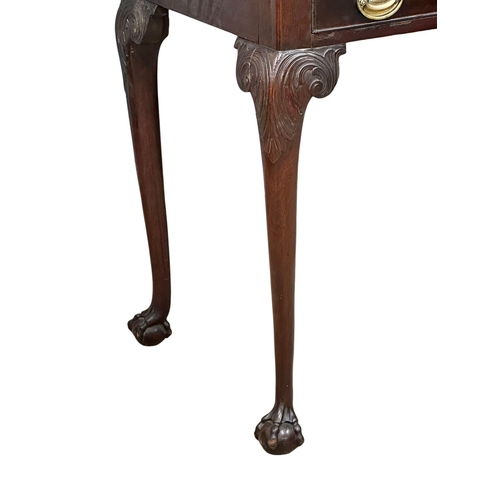 821 - A mid 19th century Irish Chippendale Revival mahogany silver table with drawer on Ball & Claw feet. ... 