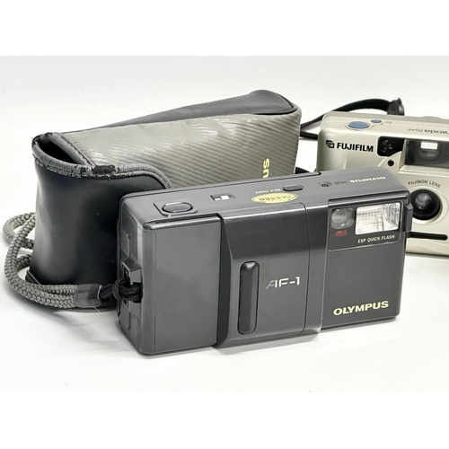 607 - 3 cameras. An Olympus AF-1 camera with case. A Hanimex 35HF camera with case. A Fujifilm Nexia 70AF ... 