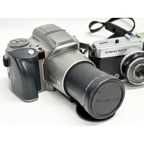 607A - 4 cameras. An Olympus IS-300 camera. An Olympus Trip 35 camera etc.