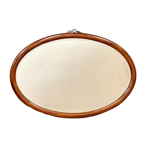 101 - An Edwardian inlaid mahogany framed bevelled 89.5x59cm