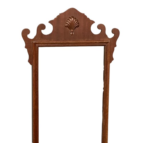 317 - A vintage 19th century style mahogany framed mirror. 43x118cm