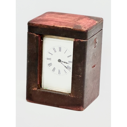 11 - A late 19th century brass carriage clock with case.